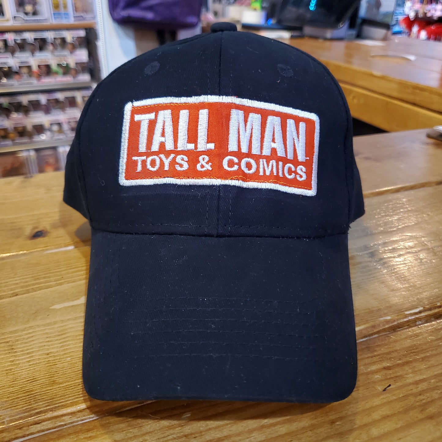 Tall Man Toys and Comics baseball cap Hat